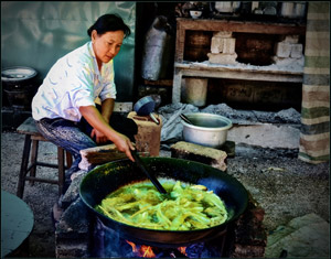 Woman Cooking Near Mandalay by Bob Pierce